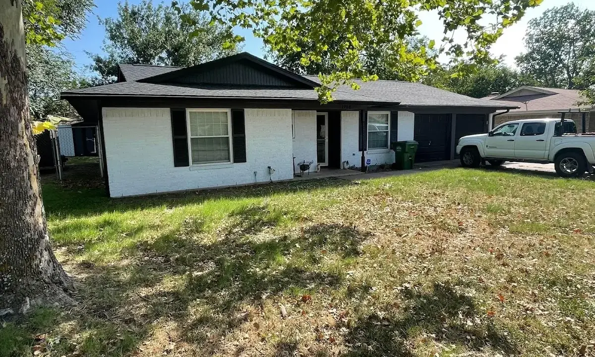 Professional roofing crew working on a residential roof in Grandview